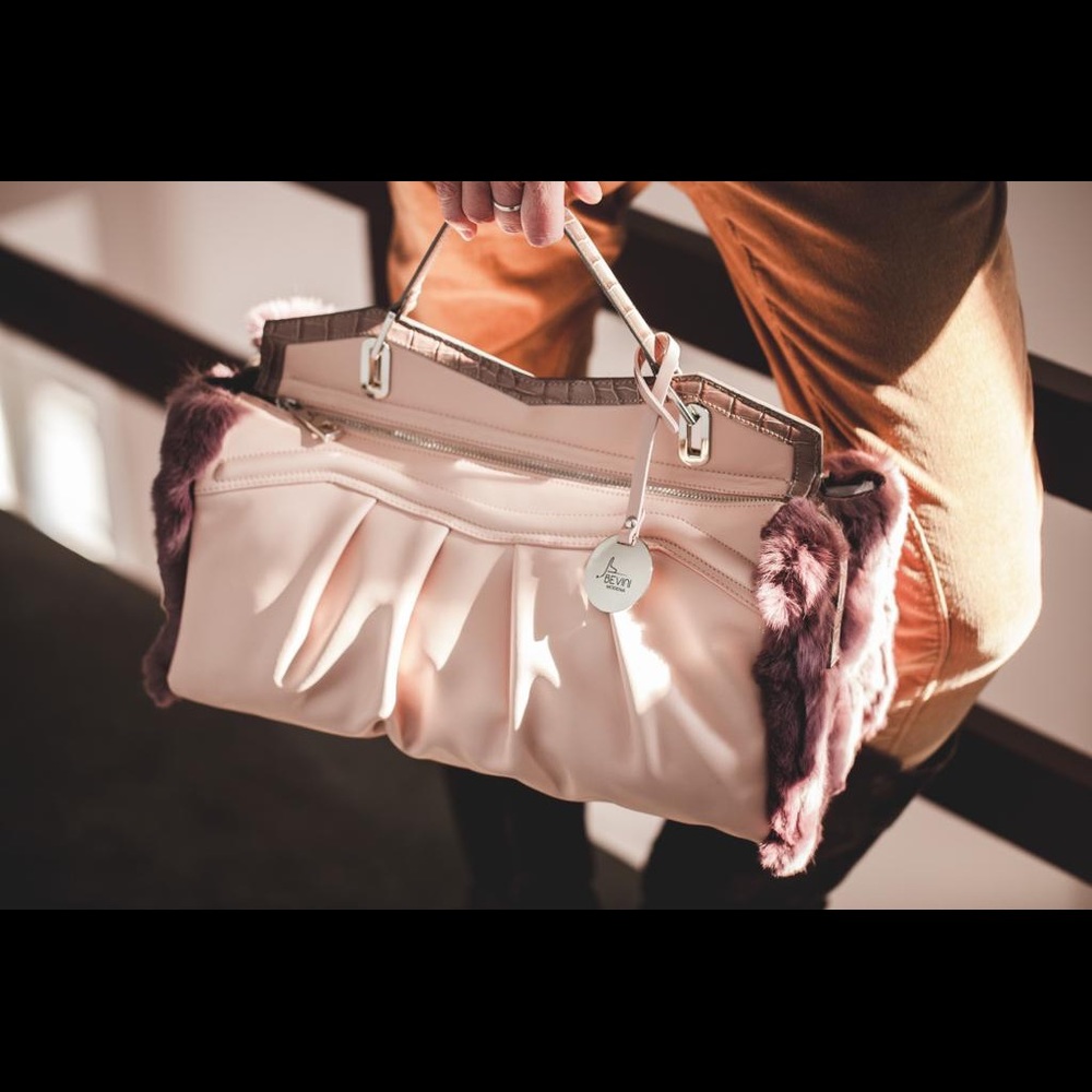 Handmade leather and rabbit fur handbag